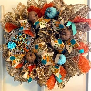 This 14” Hello Fall wreath, new thing with teal and orange animal prints